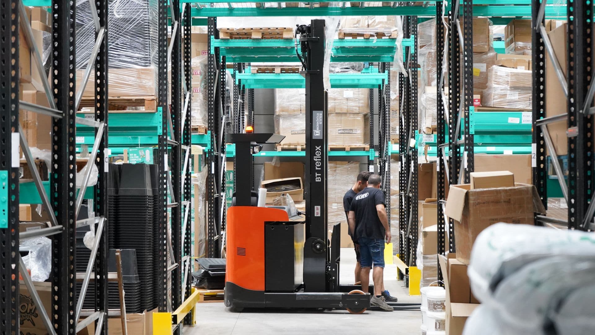 Shrink-wrapped wholesale liquidation pallets in a warehouse